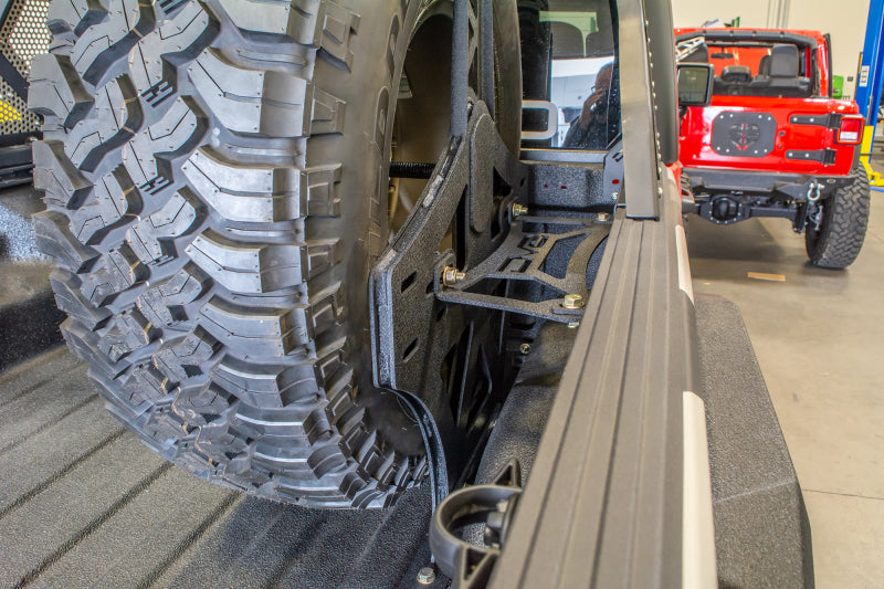 DV8 Offroad TCGL-02 2019+ Jeep Gladiator Universal Stand Up In-Bed Tire Carrier