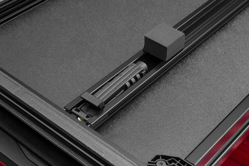 LUND 969251 Lund 09-17 Dodge RAM 1500 Fleetside (5.7ft. Bed) Hard Fold Tonneau Cover - Black
