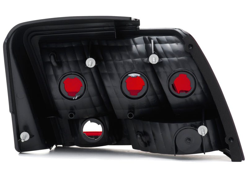 Raxiom 49080 99-04 Ford Mustang Excluding 99-01 Cobra Tail Lights- Black Housing (Smoked Lens)