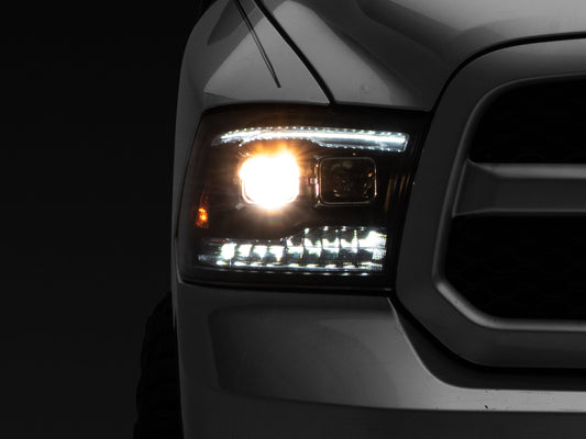 Raxiom R111520 09-18 RAM 1500 LED Projector Headlights w/ Switchback Turn Signals- Blk Housing (Clear Lens)