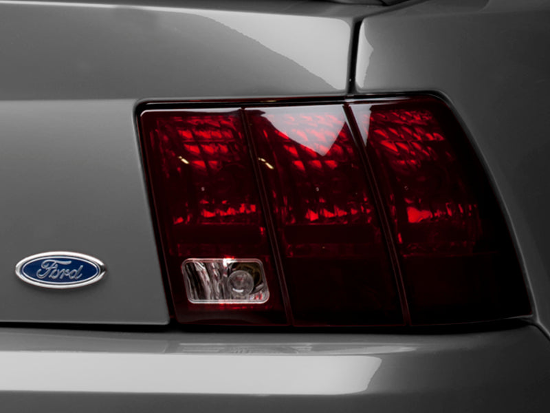 Raxiom 49080 99-04 Ford Mustang Excluding 99-01 Cobra Tail Lights- Black Housing (Smoked Lens)