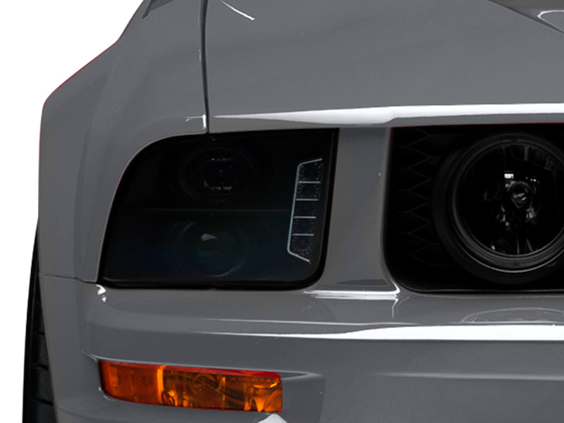 Raxiom 49128 05-09 Ford Mustang w/ Halogen LED Halo Prjctr Headlights-Blk Hsng(Smoked Lens Exclude GT500)