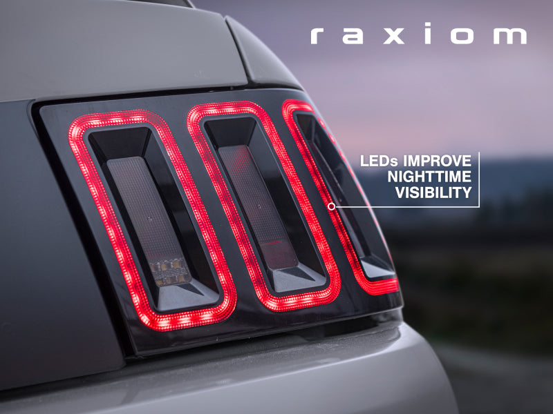 Raxiom 100807 99-04 Ford Mustang Excluding 99-01 Cobra Icon LED Tail Lights- Black Housing (Smoked Lens)