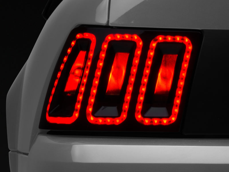 Raxiom 100807 99-04 Ford Mustang Excluding 99-01 Cobra Icon LED Tail Lights- Black Housing (Smoked Lens)