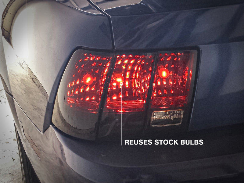 Raxiom 49080 99-04 Ford Mustang Excluding 99-01 Cobra Tail Lights- Black Housing (Smoked Lens)