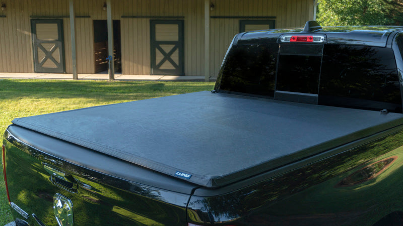 LUND 95050 Lund 99-17 Ford F-250 Super Duty (6.5ft. Bed) Genesis Tri-Fold Tonneau Cover - Black