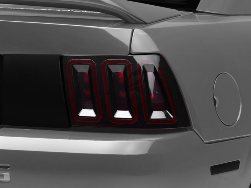 Raxiom 100807 99-04 Ford Mustang Excluding 99-01 Cobra Icon LED Tail Lights- Black Housing (Smoked Lens)