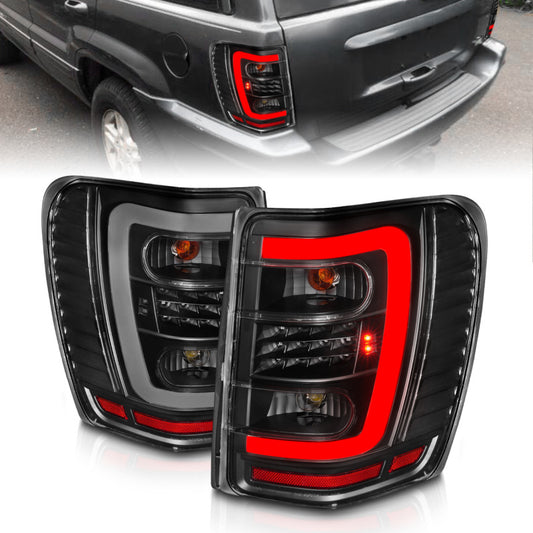ANZO 311394 1999-2004 Jeep Grand Cherokee LED Tail Lights w/ Light Bar Black Housing Clear Lens