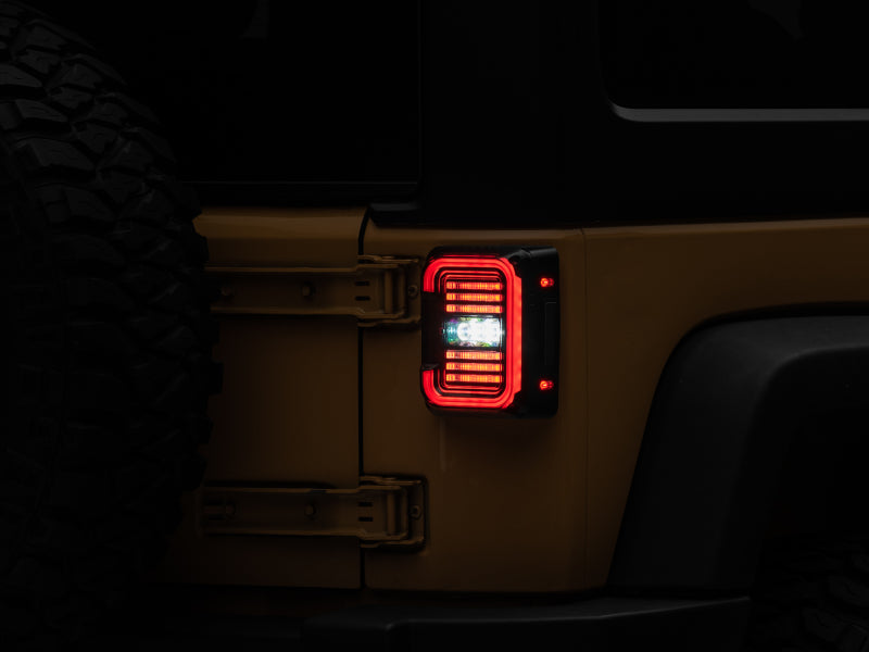 Raxiom J138358 07-18 Jeep Wrangler JK Axial Series LED Halo Tail Lights- Black Housing (Dark Smoked Lens)